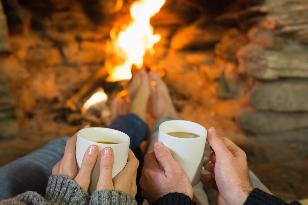 the couple in front of a bonfire